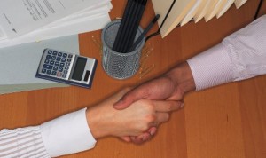 handshake over desk