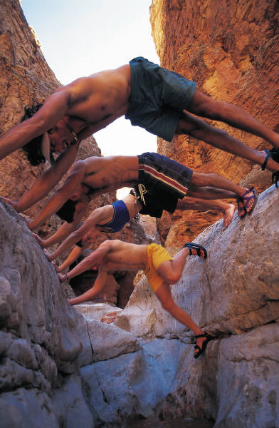 4 rock climbers in a canyon