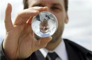 a man's image reflected in a lens