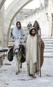 Mary on donkey, Joseph leading her through city