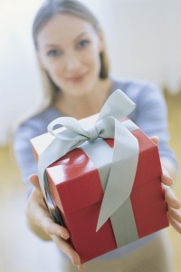 Woman Giving Gift, Portrait, Blurred.