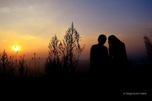 couple sitting in sunset
