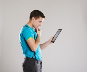 man studying a tablet