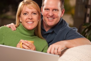 couple using laptop together