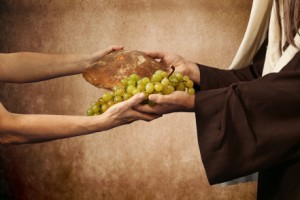 Jesus gives bread and grapes on beige background